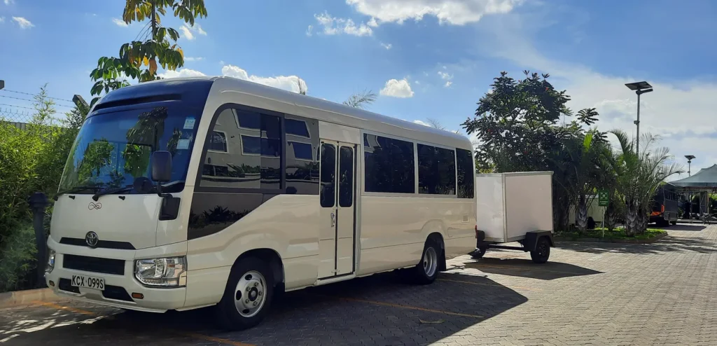 Toyota Coaster 22-seater bus with luggage trailer